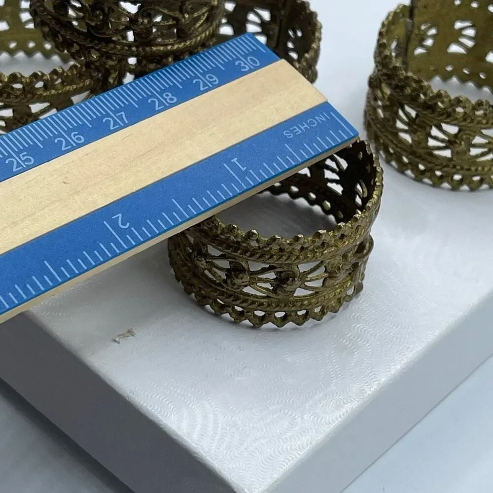 Set of 5 vintage ornate brass napkin ring holders.